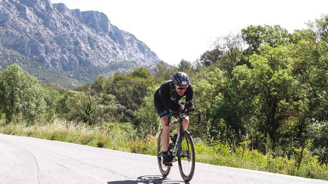 Stefano on the bike leg of Ironman 70.3 Aix-en-Provence, with Mont Sainte-Victoire in the background